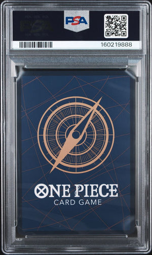 A PSA graded One Piece Card Game deck box or sleeve inside a clear PSA slab, with a dark blue background and a tan compass graphic. The PSA header is visible at the top with a barcode, QR code, and grading number.