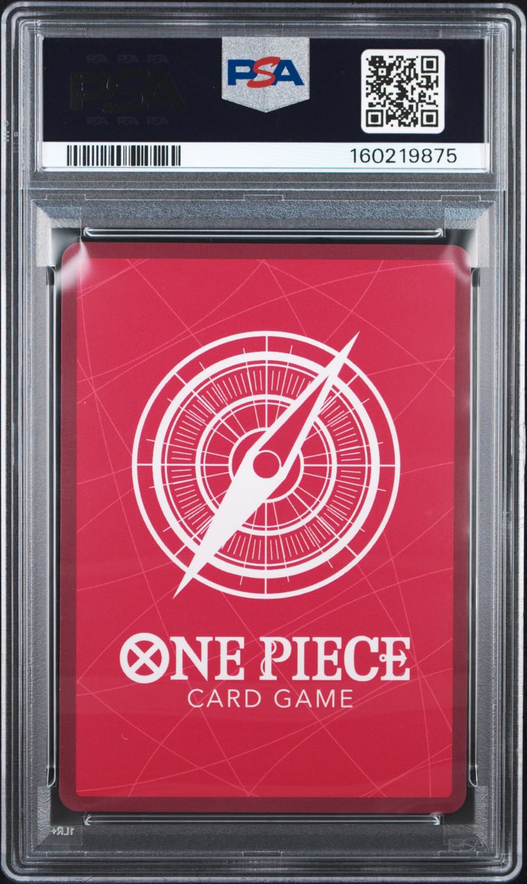 A PSA graded One Piece Card Game card featuring a red background with a white compass design and the text 'ONE PIECE CARD GAME' on the front, sealed inside a clear PSA slab.