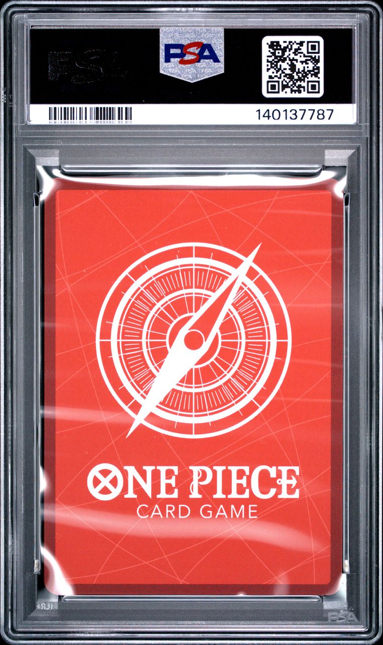 A PSA graded One Piece Card Game deck box in a clear plastic slab. The box art is bright red with a white compass design and the text 'ONE PIECE CARD GAME' at the bottom.