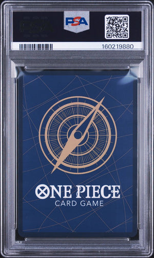 A PSA graded One Piece Card Game deck box inside a clear plastic grading case. The box is dark blue with a gold compass design and white text, and the PSA label is visible at the top.