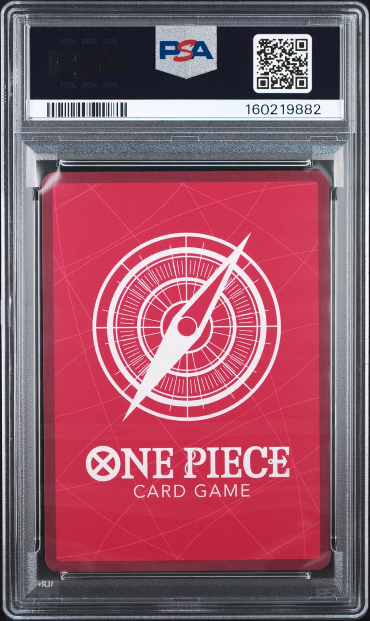 PSA graded One Piece Card Game red deck box inside a clear PSA slab, with the PSA logo and grading barcode visible at the top.