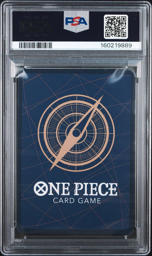 A PSA graded One Piece Card Game deck box inside a clear plastic grading case, showing a dark blue box with a gold compass design and white One Piece branding.